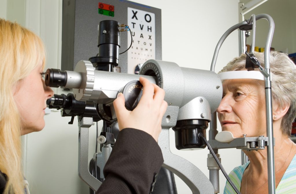 A senior woman at her optometrist's getting an eye exam to look for signs of glaucoma