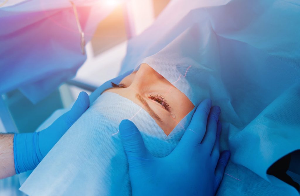 A patient in an ophthalmologists operating room undergoing PRK surgery