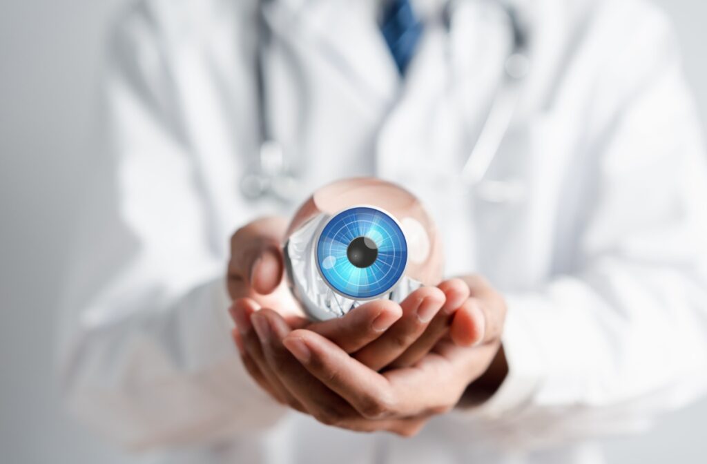 A doctor's hands holding an enlarged, digitally animated eyeball with a blue iris.