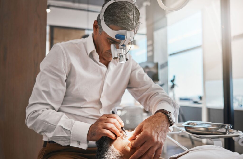 An ophthalmologist carefully removes a patient's clouded lens during cataract surgery.